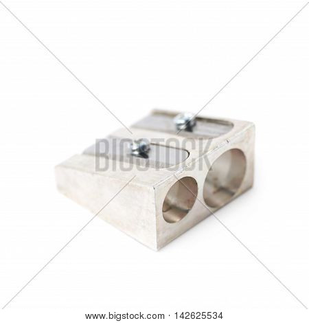 Steel metal pencil sharpener isolated over the white background