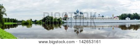 Panorama of the Tikhvin assumption male monastery, it is the Tikhvin icon of the mother of God. The Orthodox Church of Russia. The temple on the banks of the Tikhvinka river in Tikhvin.