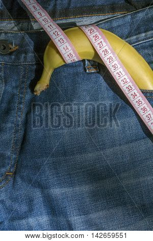 Navy blue jeans with a banana and measuring tape