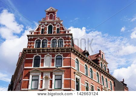 restored red brick historicist building in Hannover Germany