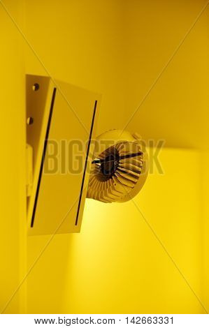 Professional modern lighting - illuminated ceiling LED lamps in modern grunge interior difussing yellow light