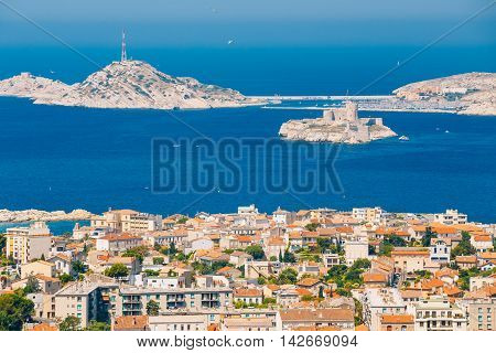 Aerial view, cityscape of If Castle in Marseilles, France. Sunny summer day with bright blue sky.