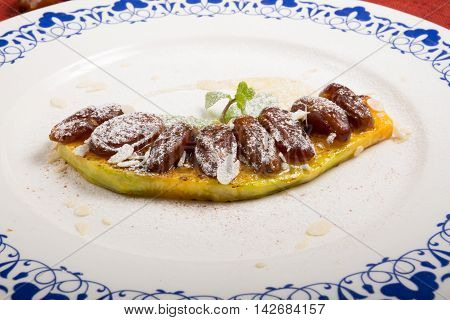 Baked pumpkin with figs and almond nuts