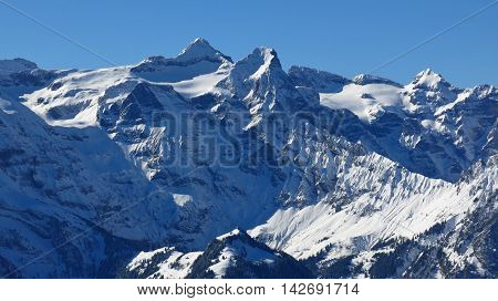Snow covered Mt Uri Rotstock. High mountain in Central Switzerland. View from Mt Fronalpstock.