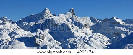 View from Chlingenstock Central Switzerland. Mt Fulen and other snow covered mountains