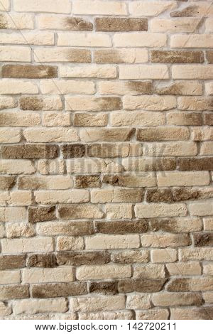 light yellow stone Wall - Background of light Brick texture copy space