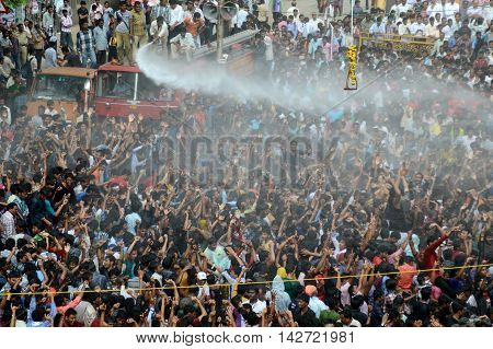 AMRAVATI, MAHARASHTRA, INDIA - AUGUST 29 : Crowd of young People enjoying 