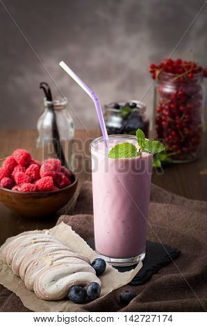 Berry smoothie and meringue on a table