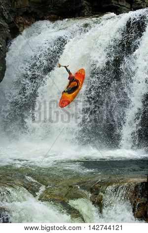 Kayaker in the waterfall in Norway, Ula river.