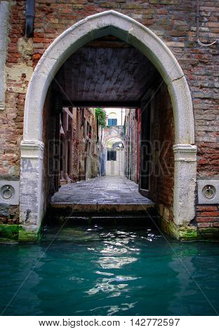 View of the streets of Venice through a beautiful arch