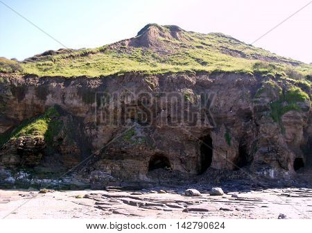 Caves in Cliff at Runswick Bay in North Yorkshire