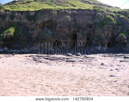 Caves in Cliff at Runswick Bay in North Yorkshire