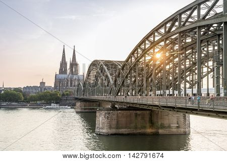 Koln Cityscape With Cathedral And Steel Bridge, Germany