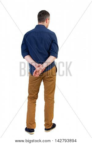 Back view of man . Standing young guy. Rear view people collection.  backside view of person.  Isolated over white background. a man in a blue shirt with the sleeves rolled up is looking pensively