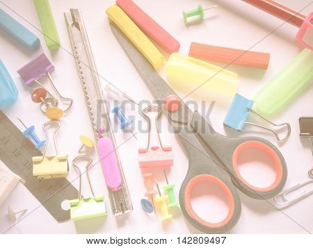 Close up office supplies on vintage style background