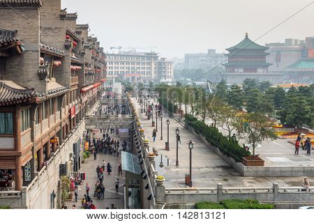 Xian China - October 17 2013: View of the square near the Bell Tower in Xian obscured in the smog Shaanxi Province China.