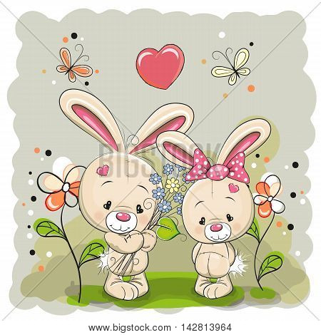 Rabbit boy and girl with flowers on the meadow