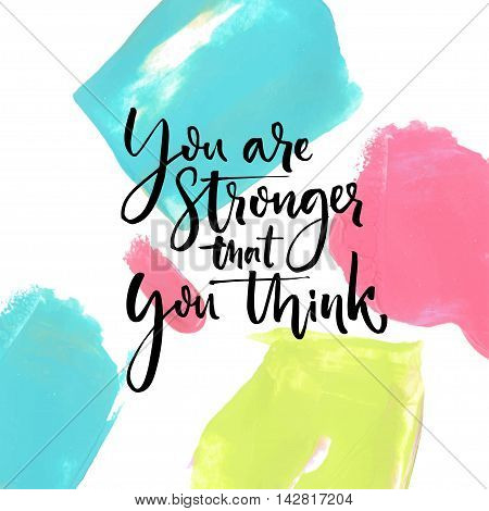 You are stronger that you think. Motivational saying at artistic paint strokes background.