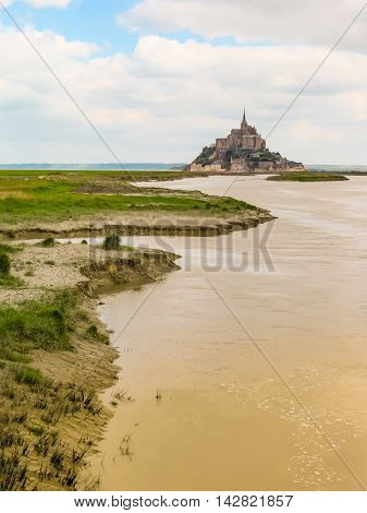 Couesnon river and Mont Saint-Michel - tidal island town and abbey. France