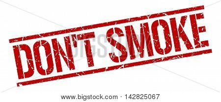 don't smoke stamp. red grunge square isolated sign