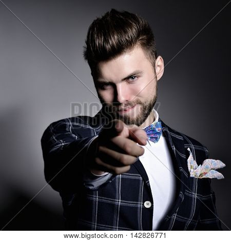Compere. Man master of ceremonies point with his finger at you.