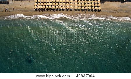 beach with umbrellas from above greece alepochori