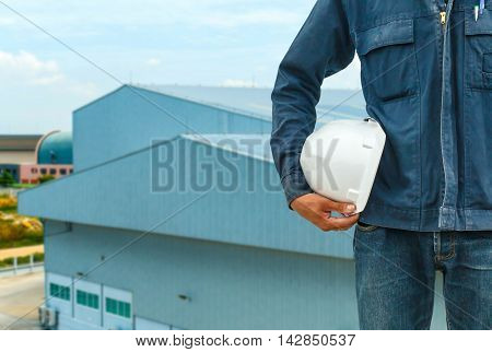 The engineering and safety helmets stood on the details of architectural metal roofing in commercial construction