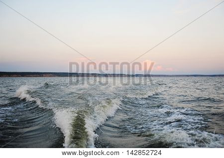 Summer sanset on the Volga river. Boat trip