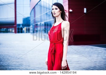 Sexy young beautiful woman in red dress