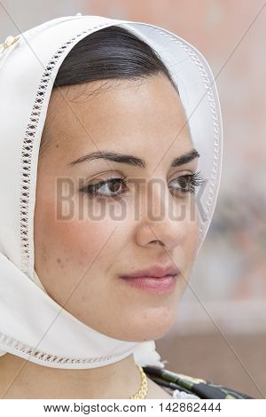 CAGLIARI, ITALY - May 1, 2014: 358 ^ Religious Procession of Sant'Efisio - Sardinia - portrait of a beautiful girl in traditional Sardinian costume