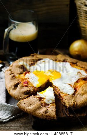 gallet with onion ham and egg . style rustic. selective focus