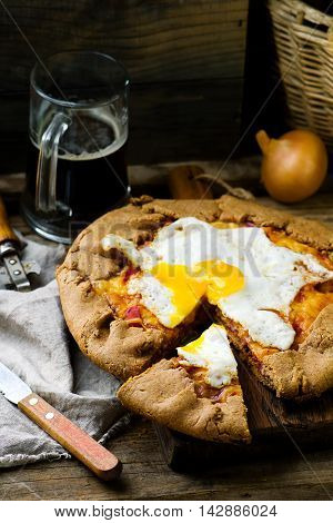 gallet with onion ham and egg . style rustic. selective focus