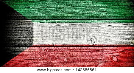 Flag of Kuwait painted on old grungy wooden background: 3d illustration