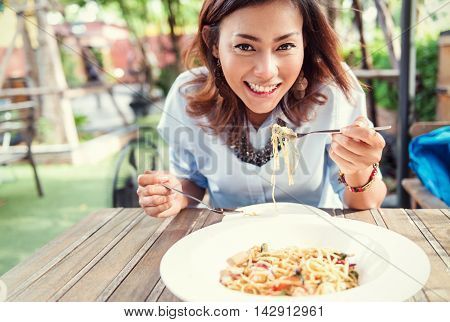 Asian women eating delicious Focus on face