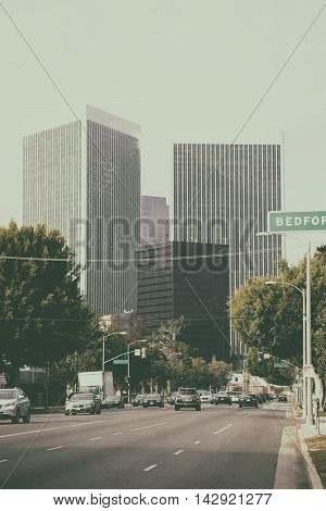 Los Angeles United States - December 27 2015: Traffic on a multi-lane road leading to the city center of Los Angeles with different skyscrapers on December 27 2015 in Los Angeles.