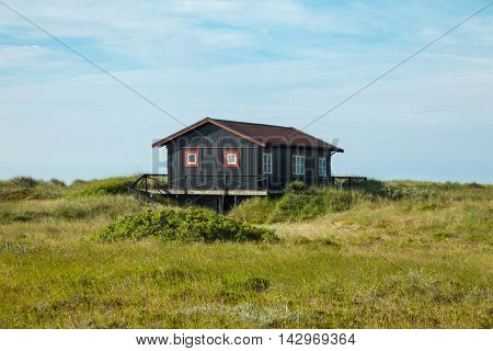 wooden house in the lawn in Skagen
