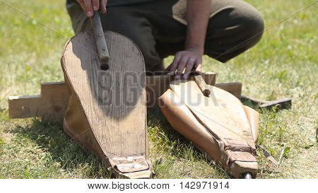 blacksmith forges inflates fur hand in summer day