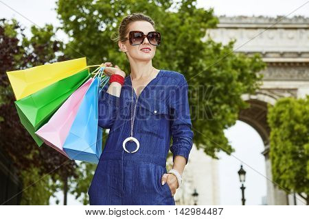 Trendy Woman With Shopping Bags Near Arc De Triomphe, Paris