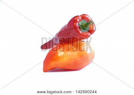 Red hot and sweet peppers isolated on white batskground