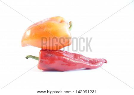 Red hot and sweet peppers isolated on white batskground
