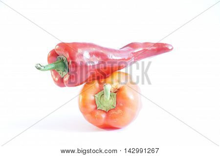 Red hot and sweet peppers isolated on white batskground