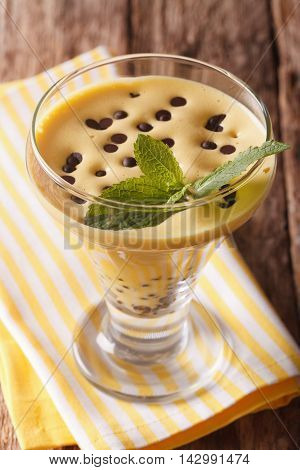 Italian Egg Cream Zabaione With Chocolate Close Up In A Glass. Vertical