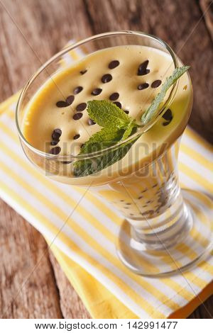Italian Zabaione Cream With Chocolate And Mint Close Up In A Glass. Vertical