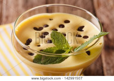 Egg Cream Zabaione With Chocolate Drops And Mint Macro. Horizontal