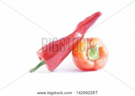 Red hot and sweet peppers isolated on white batskground