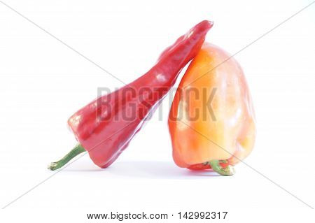 Red hot and sweet peppers isolated on white batskground