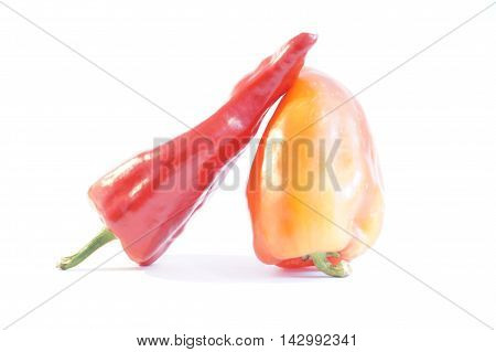 Red hot and sweet peppers isolated on white batskground