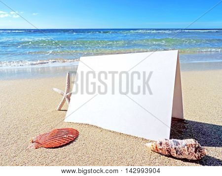 Beach with blank greeting card or business card. Beach background with copy space.