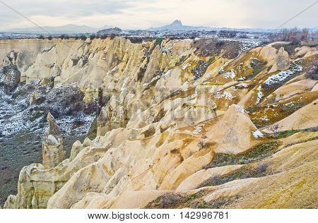 The winding slopes of the mountains in Love Valley were created for years of weathering and eolation Cappadocia Turkey.