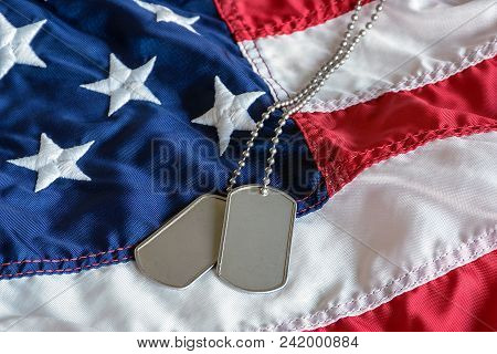Military Dog Tags On American Flag With Embroidered Stars